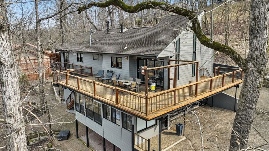 A charming blend of modern comfort and rustic charm, this spacious property boasts 3 bedrooms and 3 baths, offering ample space for relaxation and entertainment. The interior features vaulted ceilings with beautiful wood beams and windows that accentuate the space with natural light. Relax on the deck and enjoy the spectacular view of Beaver Lake or stroll down to your very own Private 2 slip dock and enjoy all your favorite lake activities. Boat dock has permanent power and 2 boat lifts; slips are 9' x 26'. Conveniently located close to downtown Rogers and Prairie Creek Marina. Enclosed sunroom is not included in square footage, estimated 268 sqft.