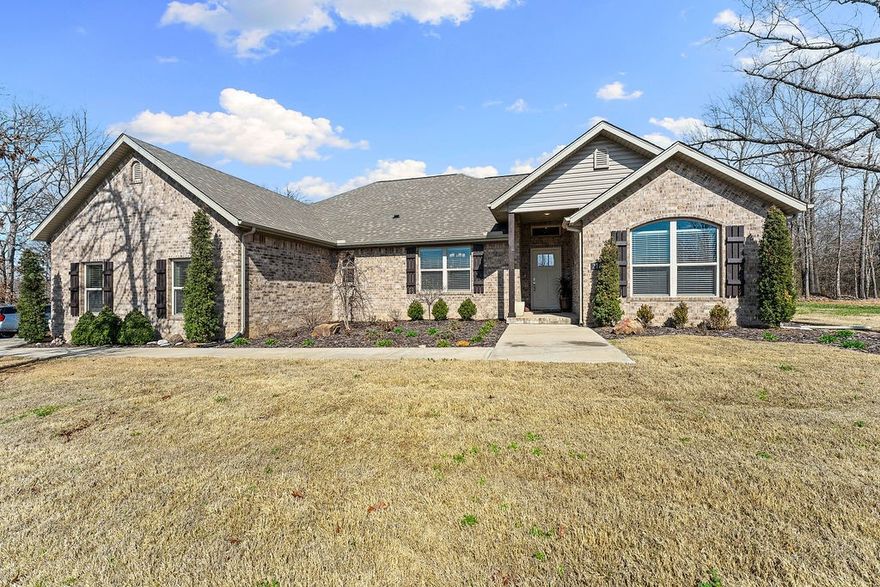 Experience this like-new construction, perfectly situated on a rare level lot. Located just minutes from Loch Lomond, Highlands Golf Course & the Tiree boat ramp, this home is designed for those who value both recreation & high-end comfort. The seamless flow begins with a light-filled, open-concept floor plan anchored by stunning hardwood flooring. At the heart of the home, the gourmet kitchen features a spacious double island, granite countertops, bar seating, & a walk-in pantry with an eat-in area. Versatility is key, with flex spaces including a dedicated office (or 3rd bedroom) & a dining room that easily transitions into a 2nd living area. The primary retreat has a double vanity, custom-tiled walk-in shower & a deep soaking tub. For ultimate convenience, the primary walk-in closet connects directly to the laundry room. Outside, the side-entry garage maintains curb appeal, while the fully landscaped yard features added trees for privacy & a storage shed that conveys. Wired for Starlink.