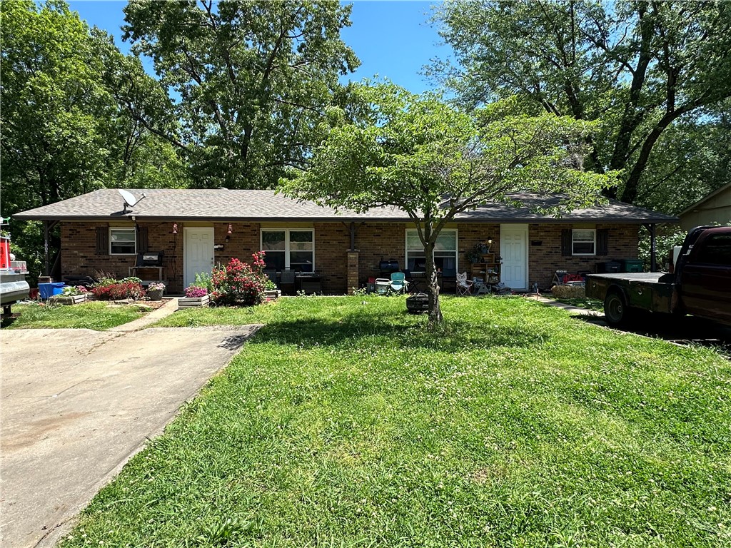 Buyer changed their mind due to tornado damage BUT all repairs taking place. Will be better than before! Cash flowing duplex only minutes away from Downtown Rogers! One unit is renovated and leases for $1100/mo with a year lease in place. Unit that has not been renovated is leasing for $725/mo with a month to month lease. Both units are a 2 bedroom, 1 bathroom space. Perfect opportunity for an owner to live in one side while renovating and rent the other or for an investor. No showings without accepted offer. Please do not disturb tenants.