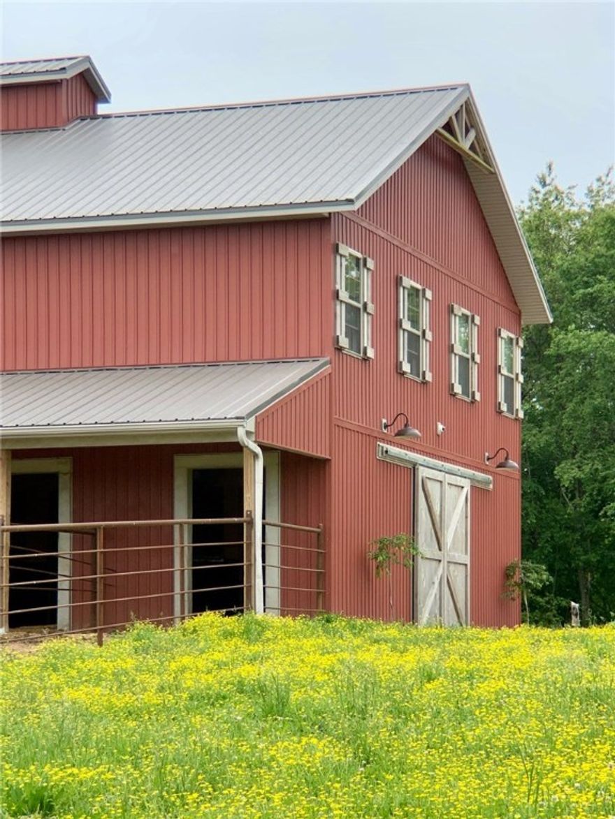 Beautiful 2BR 2 1/2BA Barndominium with open floor plan, large rooms and lots of storage. Tankless water heater and Fujitsu ductless units in each room for efficient heating and cooling. All of this above a 36'x48'barn with 4 stalls with runs, paddocks, shower, tack room and office with a 1/2 bath.  Finished out with pine siding. Detached 24'x36' garage/shop with fully floored attic. 36.15 Acres with 20ac+/-pasture, 16ac+/-woods totally fenced with some cross fencing. 2 ponds, and a 22x28 pole barn.  RV parking pad with all hookups. Perfect for small farm, horse boarding, Air BB for those who love to travel with their horses, event venue,  development potential, or build your dream home! So many options!! Agent owned. Also listed under MLS#1151316 and MLS#1151542