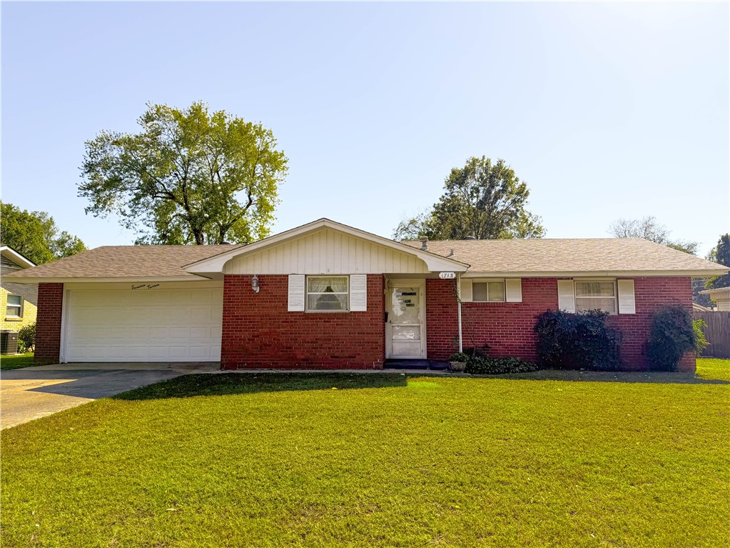 Looking for a solid mid-century home with an extra 2 car garage and shop located right in your backyard - look now future! This well loved home is located in the heart of Springdale. Close to schools, shopping and I49. All brick home with new roof and heat/air. Screened in porch for summer fun and extra large fenced in backyard.