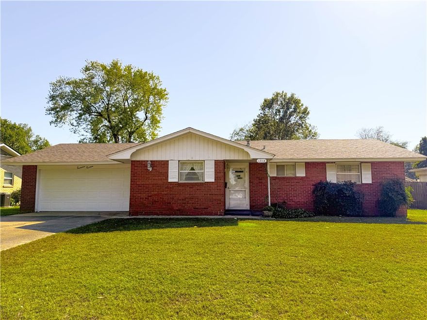 Looking for a solid mid-century home with an extra 2 car garage and shop located right in your backyard - look now future!  This well loved home is located in the heart of Springdale. Close to schools, shopping and I49.  All brick home with new roof and heat/air.  Screened in porch for summer fun and extra large fenced in backyard.