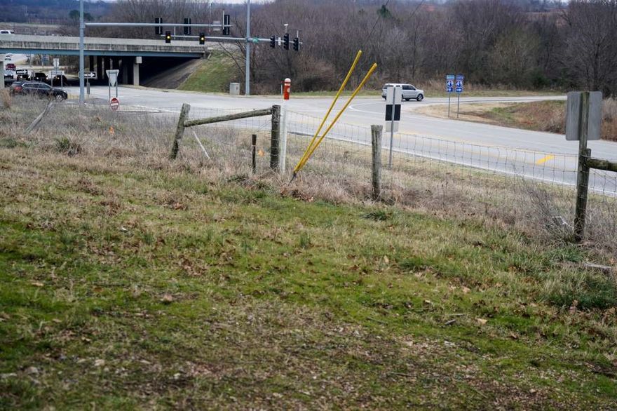 NWC of I-49 and Johnson Mill Road! Regional location one of a handful of I-49 corners remaining in NWA. 
Potential for multiple commercial uses. Ascending topo offers dramatic views looking over I-49 for your business to be noticed along with excellent access. Water and sewer at next door tract within 100' of property. Call agent for details.