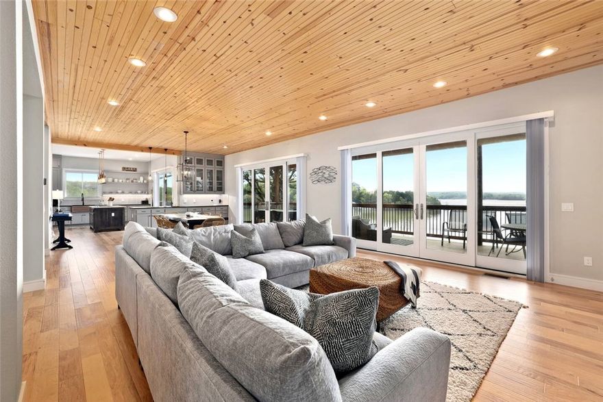 Modern Beaver Lake retreat with sweeping water views and direct access to a public boat launch and beach area. Finished with high-end appliances, stylish furnishings, and thoughtful touches throughout, this home blends luxury and comfort in a way that makes everyday feel like vacation. Gather in the open main living area, unwind in the bonus room, or enjoy meals and sunsets from the covered deck outfitted with outdoor dining and lounge furniture. The layout offers space for work, relaxation, and hosting, all while keeping the lake in sight. Conveniently located about ten minutes from downtown Rogers for shopping, dining, and essentials. Ideal for those seeking an elevated lake lifestyle. Available fully furnished beginning February 1st.