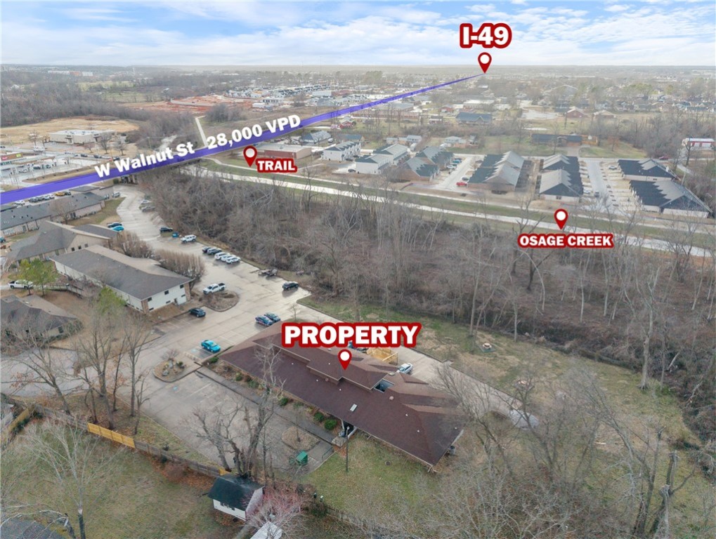 +/- 200 SF office space now available just off W Walnut in Rogers! This suite is ideal for individuals
seeking a dedicated workspace in a convenient location. The property boasts a newly built deck, a bike
rack at the entrance, and shared amenities, including a break room, conference room, and restrooms.
Additionally, common areas are professionally cleaned by Molly Maids, and each suite benefits from
individual trash collection services. Positioned right next to Osage Creek and a paved biking/walking tail,
also situated approx. 1.5 miles from I-49, the major interstate system that runs through Northwest
Arkansas. Don't miss this opportunity to secure a well-maintained office space in a prime location! Can be combined with Suite 11 for an additional 190SF if a larger space is needed.