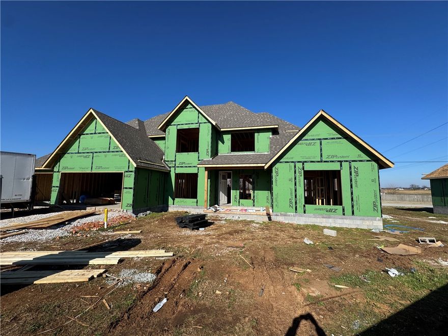 Walk to the community pool or skip across the street to the Razorback Greenway! This new construction, 5-bedroom home is bursting with curb appeal and includes an oversized 3 car garage with the third bay deep enough for any of your toys or for extra storage. Hang out in the living room with an impressive 20-foot soaring ceiling and open to the kitchen and dining area. The primary bathroom feels like a spa with two shower heads and a bathtub in a dedicated wet area with a linear drain.  Some other features include 3 cm quartz counter tops throughout, custom cabinets with soft close drawers/doors, Frigidaire Gallery appliances (cooktop vented to the exterior, & wall oven/microwave), custom powder coated handrails on the stairs, tiled shower surrounds in the other two bathrooms, custom mirror frames, low-e windows, fence, blinds, gutters, & an irrigation system.  Did I mention you can pick colors if they're available. We have some preferred lender incentives with local lenders up to $5,000 as well.