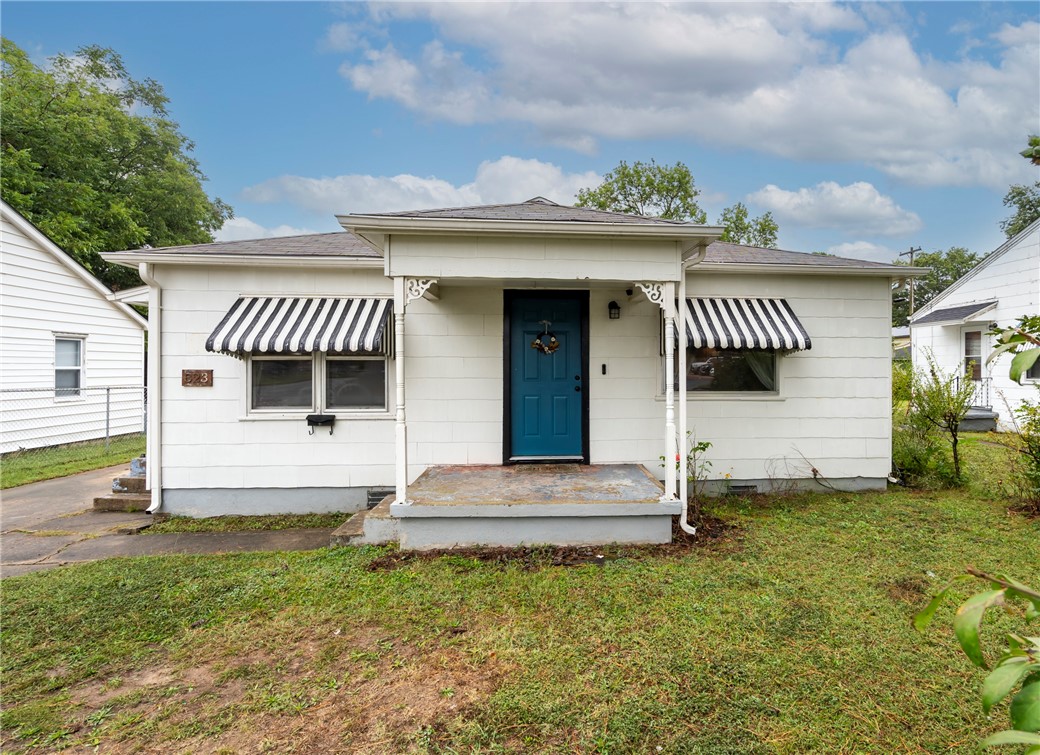 This charming home has been remodeled recently and is kicated in the heart of Siloam Springs! This cottage style home has 2 bedrooms and 1 full bath. The remodeled kitchen is bright and modern with custom cabinets, granite counters, new stainless appliances and space for dining. The gorgeous window trimming, wood flooring, and neutral color palette make this home charming and cozy. There's even a 1 car detached garage for extra storage and opportunity to make it whatever you want.