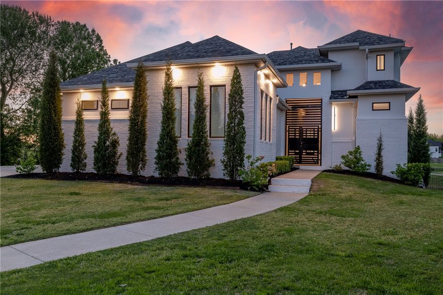 If you are looking for a home that will truly WOW you, this is it! Designed with both connection and space in mind, this 5 bed 5.5 bath home offers multiple living areas across all levels, creating the perfect balance for gathering and privacy. The main level features a spacious living area, half bath for guests, a private primary retreat, and an additional suite with its own entry, ideal for guests or multi generational living. Upstairs offers 2 BD/ 2BA and a flexible bonus space, while the walkout basement creates the ultimate hangout with a full bar, gym area, bed, and bath. Step outside to a resort style setting complete with a stunning infinity edge pool overlooking the water and multiple patios designed for hosting, relaxing, and enjoying the view. Don't miss the workshop area/garage! Thoughtfully laid out and full of possibility, this home is built for the way people truly live, in one of the area’s most desirable locations just minutes from Rogers/Pinnacle, and less than 20 minutes to Downtown Bentonville.