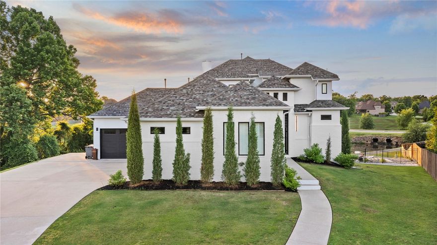 If you are looking for a home that will truly WOW you, this is it! Designed with both connection and space in mind, this 5 bed 5.5 bath home offers multiple living areas across all levels, creating the perfect balance for gathering and privacy. The main level features a spacious living area, half bath for guests, a private primary retreat, and an additional suite with its own entry, ideal for guests or multi generational living. Upstairs offers 2 BD/ 2BA and a flexible bonus space, while the walkout basement creates the ultimate hangout with a full bar, gym area, bed, and bath. Step outside to a resort style setting complete with a stunning infinity edge pool overlooking the water and multiple patios designed for hosting, relaxing, and enjoying the view. Don't miss the workshop area/garage! Thoughtfully laid out and full of possibility, this home is built for the way people truly live, in one of the area’s most desirable locations just minutes from Rogers/Pinnacle, and less than 20 minutes to Downtown Bentonville.