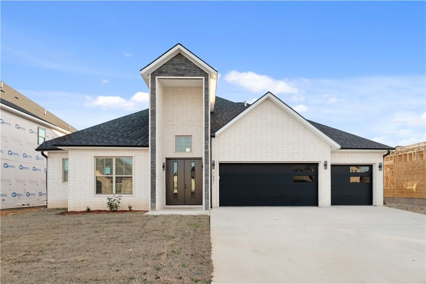 Location matters, and this one delivers. 1851 Lotus Road is a move in ready new construction home in Silver Leaf Estates, a growing Centerton community zoned to Bentonville Schools. This home will have access to a clubhouse, pool, fitness room, walking trails, pond, and dog park. Inside, tall ceilings and natural light throughout set the tone. Three bedrooms on the main level, including a private primary suite set apart for added privacy. The living room features custom built ins and a gas fireplace and opens to the kitchen, where quartz countertops, custom cabinetry, a large island, pantry, and designer lighting create a space that feels polished yet comfortable. The primary suite offers a spa style bath with a walk in shower, large tub, and oversized closet. Upstairs, a large bonus room, additional bedroom, and full bath provide flexible space for guests, work, or media.Convenient location less than 20 minutes to Downtown Bentonville and the new Walmart Home Office, and under 15 minutes to XNA Airport.