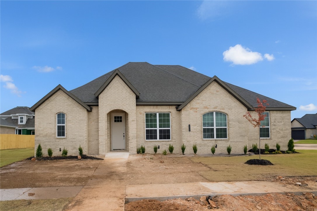 As Pea Ridge grows into one of Northwest Arkansas’s most sought-after areas, Concord stands out as the ideal neighborhood to plant your roots. Welcome to the 2,335 sq. ft. Plan! This beautiful home offers 4 bedrooms and 2.5 bathrooms, along with a side-load 3-car garage that enhances its curb appeal. Just off the garage, you’ll find a mudroom that conveniently connects to the utility room — perfect for busy households.The open-concept living, dining, and kitchen area creates a spacious yet welcoming feel, ideal for entertaining or relaxing with family. A half bath off the kitchen and dining area adds convenience for guests.The primary suite is thoughtfully separated from the other bedrooms by the main living area, providing a sense of privacy and tranquility. Inside, you’ll enjoy beautiful granite countertops throughout, luxury vinyl plank flooring in the main living areas and cozy carpeted bedrooms. Step outside to your covered back patio and fully fenced backyard, offering the perfect space to entertain outdoors.