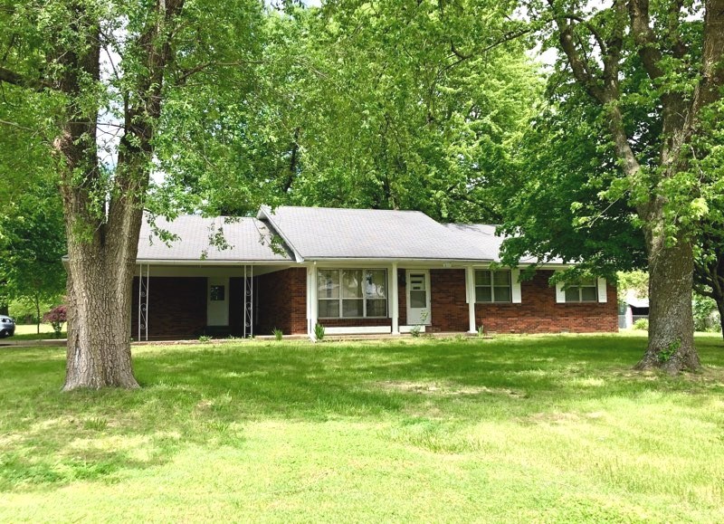 Nice 3 BR, 2 BA on extra large corner lot. Great storage/workshop with electric. 2 car carport. Don't miss this one!
