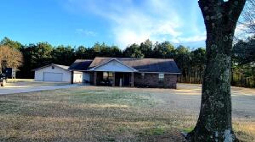 Country cutie on 6.36 acres complete with a 30 x 40 insulated shop. The brick home is a 2 bedroom 1.5 bathroom that has been recently remodeled. Such as a newly remodeled kitchen, bathrooms, laundry, and all new appliances. New interior doors and trim throughout, with all fans and light fixtures new and updated. The large, insulated shop includes water, power doors on both ends, tongue and groove walls with old barn tin feature, as well as built in cabinetry for storage and organization. There is a carport with storage, a 20 x 30 metal shed and a small fenced area in the backyard. The backyard offers a covered patio off the house perfect for entertaining your guests.