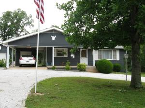 Crisp, clean and very well maintained is the best way to describe this lovely 2 bedroom home in a quiet, peaceful setting. Large shop with oversized roll up door for your larger boats or trucks and a tree house fort for the kids. Price includes home and four lots.