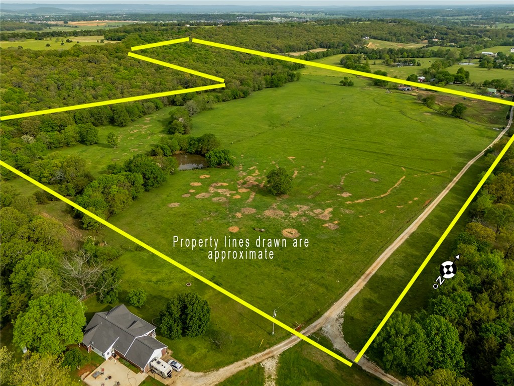 Looking for the perfect spot to build your dream house or to start your hobby farm... then you have found it! 71 Acres with a mix of pasture & trees on a dead-end road with paid water tap and pond for all of your animals! Enjoy beautiful sunsets while watching the kids fish in the pond. A wet weather creek runs south to north across the west side of the property. Power runs across the east side of the property making it easy to start your dream home! Parcels of land this close to town do not come along often! Easy access to Prairie Grove, Lincoln, Greenland & Farmington. Make plans to view this amazing property before it is too late!