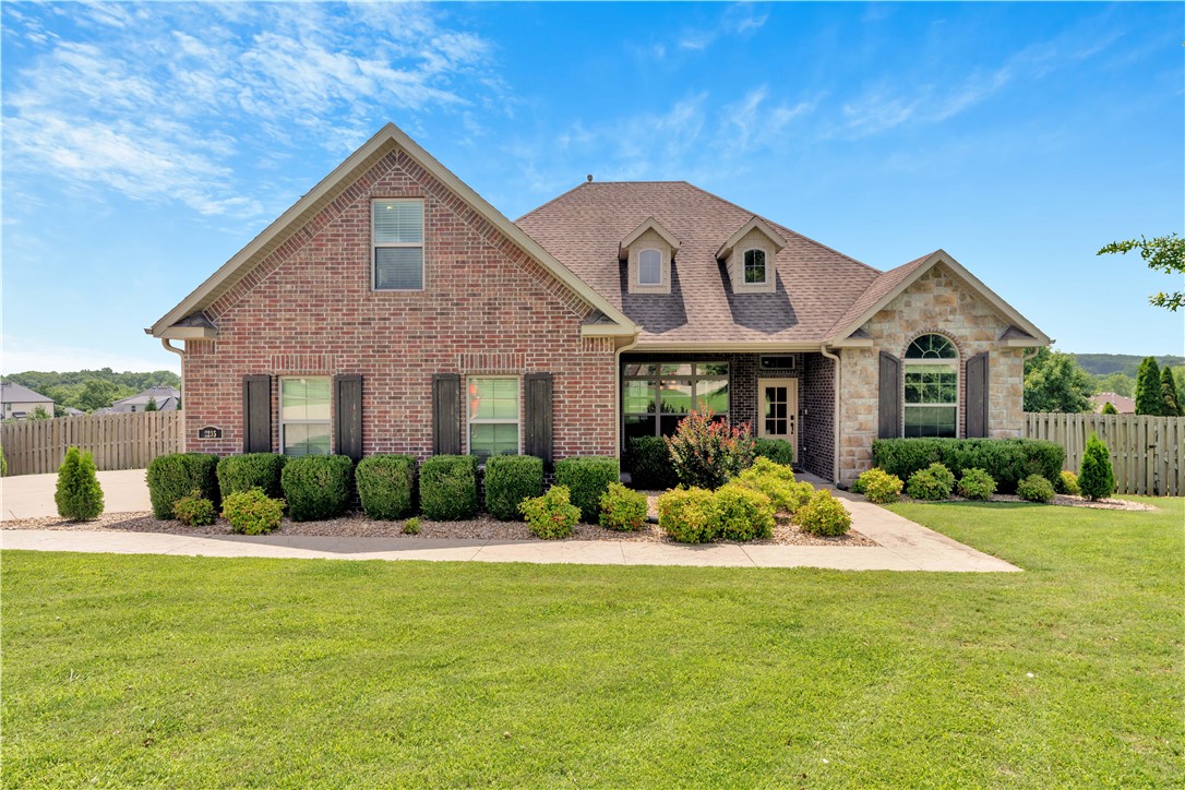 Welcome to this stunning home in the highly sought-after gated community of Waterford Estates in East Fayetteville! This 4-bedroom, 3-bath beauty offers 2,545 sq ft of stylish living space with a split-level layout and upstairs bonus room. From the moment you arrive, the curb appeal shines with a charming covered front porch and a spacious 3-car side-entry garage. Inside, vaulted ceilings with wood beams, hand-scraped hardwood floors, and a cozy gas fireplace set the tone. The gourmet kitchen features new stainless appliances, granite countertops, pot filler, gas cooktop, formal dining, and an eat-in area. The luxurious primary suite includes a spa-inspired bathroom and a huge walk-in closet. Enjoy outdoor living on the covered back deck overlooking the large, fenced yard. Residents of Waterford Estates enjoy access to a private clubhouse and pool. This home blends elegance, comfort, and convenience in one of Fayetteville’s finest neighborhoods. The well-maintained 1 owner home can’t wait to meet its new family.
