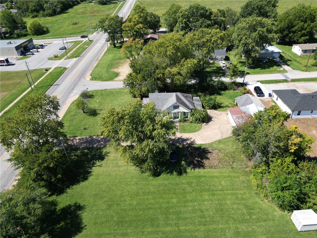 Introducing an enchanting old home nestled in a prime location, awaiting your creative touch. This commercial lot, strategically positioned on a corner, offers a plethora of opportunities for imaginative entrepreneurs. Located in close proximity to Allen Elementary School, a fire station and several neighborhoods. While time has take its toll on this vintage gem, its potential shines through. Picture a grand law office, exuding sophistication and professionalism., where clients feel instantly at ease. Alternatively, envision a charming retail store, captivation passerby with its unique character and curated selection. Embrace the allure of yesteryears by transforming it into an antique shop, a treasure trove for collectors and history enthusiasts. However, the possibilities don't end there. This worn yet captivating house can serve as a blank canvas, eagerly awaiting your vision. Embrace the charm of the past, infuse it with your unique vision, and unlock the hidden potential.