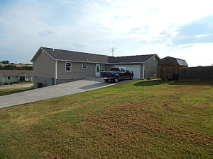 Immaculate home with fenced in area for pets or garden....room for RV parking, large deck overlooking valley. Newer subdivision, corner lot, large open living room, owners relocating and have reduced several thousand-great value on a large well-kept home. Huge walk-in closet for master-custom built for owners.