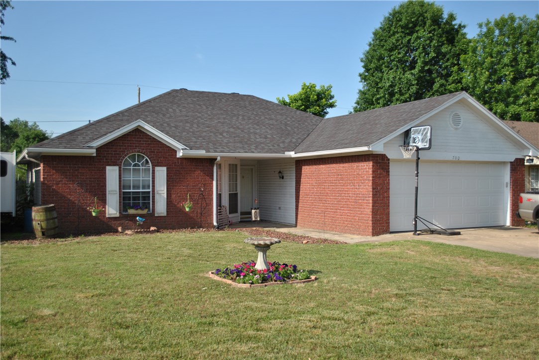Cute 3 bedroom, 2 bath home located conveniently to all of Northwest Arkansas. Hardwood floors, cathedral ceiling in living room and spacious backyard. Eat in kitchen with new stove and 1 year warranty.