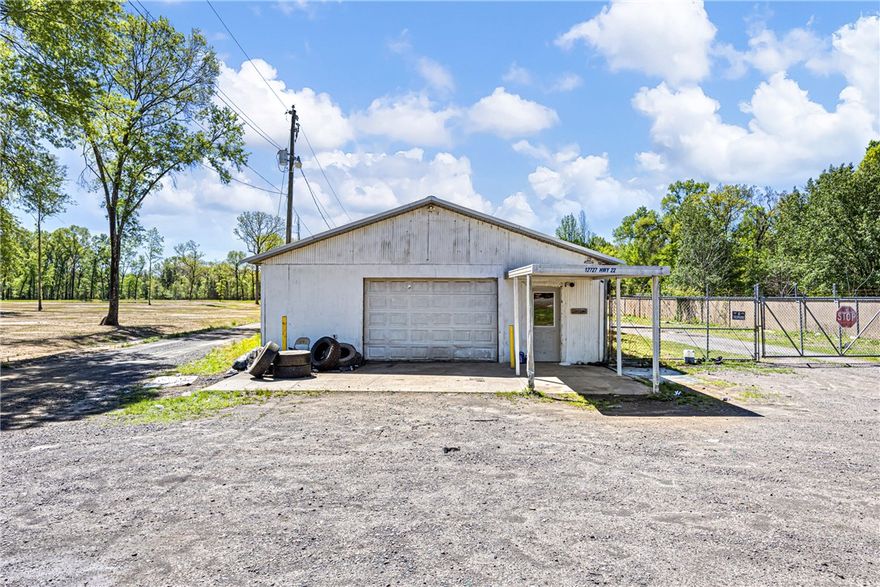 Bring your business vision to life with this versatile commercial property offering endless potential and prime highway frontage for maximum visibility! Situated on approximately 1 acre, this property features a partially fenced layout and is ready for a variety of uses. Inside, you’ll find a spacious building featuring office/workspace potential, a bathroom, ample storage, and multiple garage bays with garage door openers already in place. Whether you’re envisioning a shop, warehouse, automotive space, contractor headquarters, retail conversion, or investment opportunity, this property is your blank canvas to create something incredible. With room to expand, space to park, and exposure to passing traffic, the possibilities here are endless. If you've got the vision, this property has the potential, call today!
