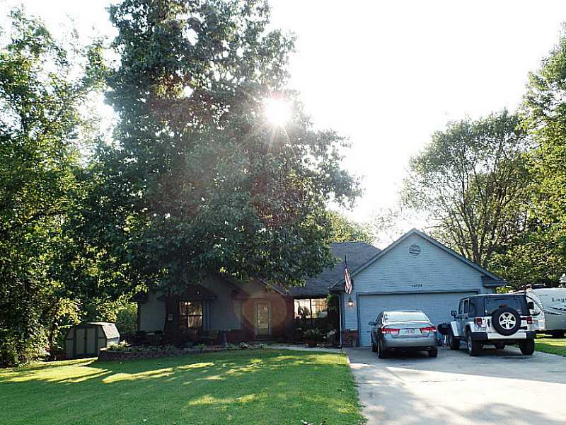 Lovely country setting for this 2376 sf house with LR, office and large den. Nice hardwood floors, newer tile in baths. Located on a beautiful lot just under one acre with large deck and patio. Seller providing a home warranty