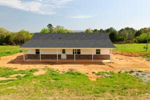 This newly constructed 3 bedroom two bathroom home sits in .786 acres in a beautiful, peaceful country setting. It has an open floor plan with the master bedroom and other bedrooms on opposite sides of the home. The house has a nice-sized laundry room and spacious bathrooms. It has beautiful wood vinyl plank flooring and a lovely paint color throughout the 1500 sqft. Finishing touches are being completed and it will be ready for it's new owners soon. Make it yours and enjoy the beautiful views from this adorable home!
