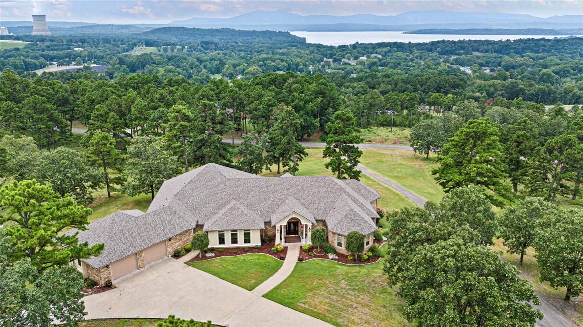 Tucked away in peaceful seclusion, this stunning executive home offers panoramic lake views from nearly every room. Designed for both relaxation and entertaining, the outdoor spaces are truly an extension of the home ā complete with multiple seating areas and a full outdoor kitchen, perfect for enjoying quiet mornings or evenings under the stars. Inside, the open-concept living area is flooded with natural light, thanks to a wall of windows that perfectly frame the water beyond. A custom, gracefully winding staircase anchors the space, adding a touch architectural flair.
The expansive master suite offers a private sanctuary with its walk-through shower, generous walk-in closet, and of course ā breathtaking views to wake up to each day.
If you're looking for a home that blends luxury, privacy, and jaw-dropping scenery ā this is it.
24-hour notice required for showings