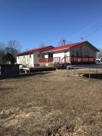 If living off the land is what you desire this is the property for you. This home sits on 20 acres with fenced pasture and chicken coop. Garden area and small fruit orchard along with Chesnutt black berries and muscadine vines. If that is not enough ride your ATV thru the woods and hunt the many deer and turkey. The home features new metal roof and fire place that heats the entire home or central H&A and private well all on a dead-end road only minutes to the Buffalo National River or the Crooked Creek.