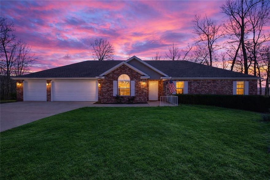Tucked away on 1.15 acres near beautiful Beaver Lake, this spacious home offers the perfect blend of privacy, comfort, and everyday convenience. The 4-bedroom, 2.5-bath residence with approximately 2,238 sq ft features a welcoming layout designed for relaxed living and entertaining. The kitchen includes granite countertops, pantry storage, and an eat-in dining area, opening to a comfortable LR with gas-log fireplace—perfect for cozy evenings at home. Step outside to expansive multi-level decks, idealfor morning coffee, weekend gatherings, or simply enjoying the peaceful wooded surroundings. The generous lot provides room to spread out while still being easy to maintain. Located just minutes from Beaver Lake marinas, parks, and outdoor recreation, and convenient access to shopping, dining, schools, and Rogers amenities. Whether you enjoy boating, fishing, hiking, or simply relaxing in nature, this location supports an active and balanced lifestyle. A rare opportunity to enjoy lake-area living with space and privacy.