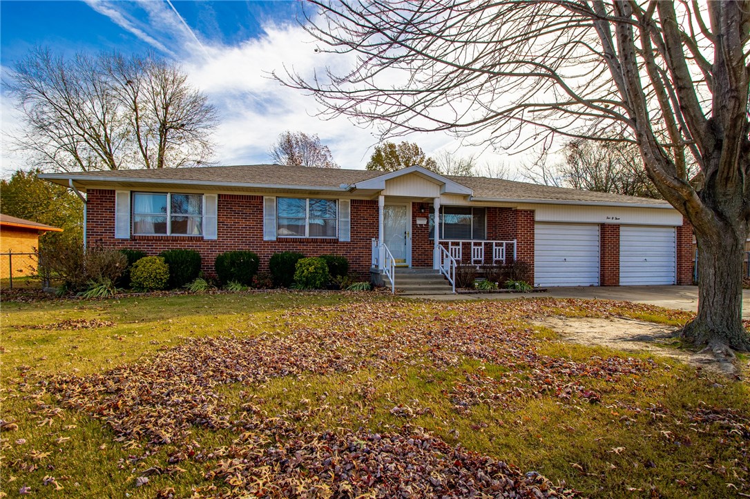This charming home features 2 living areas, built-ins, wood burning stove, eat-in kitchen, hardwood floor, large utility room, ample amounts of storage, sunroom, large backyard, and storage building! Neighborhood is conveniently located close to restaurants, schools, and I-49. 250 sq ft sunroom is not included in square footage (all it lacks is heat/air) Great source for future equity! Call today to schedule a showing.