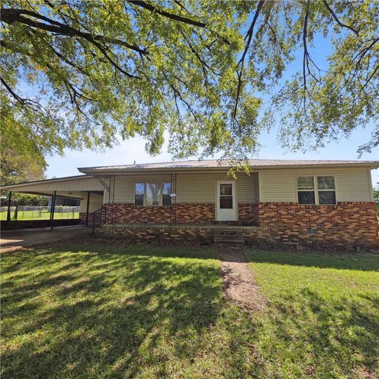 3 bedroom 1 bath home with 2 car attached carport plus a 2 car detached carport. Half acre corner lot offers room for gardening and other outdoor activities. It has a lean to behind attached garage and an outbuilding for storage and hobbies. It has a shaded front porch and front yard. The home has vinyl siding, metal roof, packaged HVAC unit, and newer vinyl windows. All offers to be submitted via Res.net by buyer's agent. Offers will be entertained after property has been exposed on the MLS for 7 calendar days.