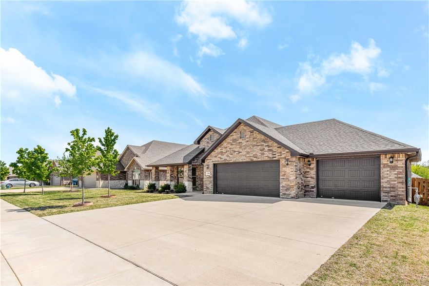 Spacious 4-bed, 3-bath home with over 2,300 sq ft located and an open floorplan perfect for entertaining. High ceilings, large windows, and natural light create a bright, airy feel. Granite countertops and stainless steel appliances complement the gourmet kitchen. The inviting living area features a cozy fireplace. Enjoy evenings on the covered deck or relax in the large master suite with walk-in closet, dual vanities, and separate tub and shower. Includes a 3-car garage, fenced yard, and exterior downlights. Situated in the highly rated Bentonville school district and conveniently located near parks, shopping, entertainment, airport, and just a short commute to the new Walmart campus.
