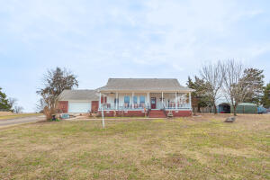 Enjoy serenity and peaceful living as you relax on your front porch gazing out over 78+/- Acres of fenced and crossed fenced pastureland with gorgeous mountain views. Creek with swimming holes for family summer fun, complete with a pond and 50x60 barn for your livestock. Just under 2100 sqft home with a great kitchen, formal dining room, and split floor plan. Detached garage for additional storage and parking, and storm shelter included! New roof and appliances in 2019