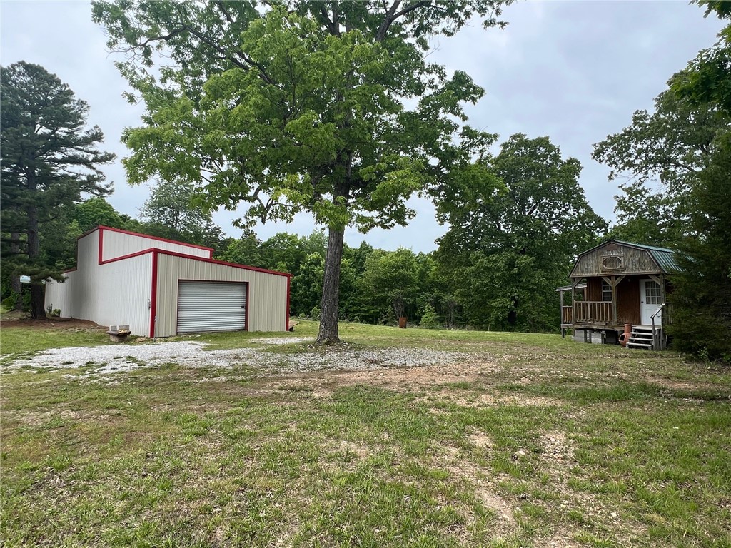 Only 7 minutes from Jasper square, and close to Hasty access to Buffalo River! One bedroom, one bath cozy cabin with everything you need to keep you comfortable. Metal roof, mini split, full bathroom, mini split for heat and cool, two porches, located on 2.11 acres of Hwy 74E frontage with 20'x100' metal shop with concrete floors, 3 roll up garage doors, and RV hookup. Shop is perfect for large hobby shop or running a business. Use cabin as base for employees or owner to use for residential to start a business. Lots of opportunities!