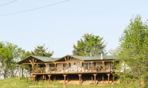 Live large in this beautiful home sitting on almost 5 acres. Enjoy the perfect view sitting on the large front porch, overlooking pristine pasture and rolling mountains in the distance. Have fun in the updated kitchen with great appliances and new cabinets. Don't worry about updating the bathroom, it is already done! At only $50 a square foot, you have to come take a look at this one!