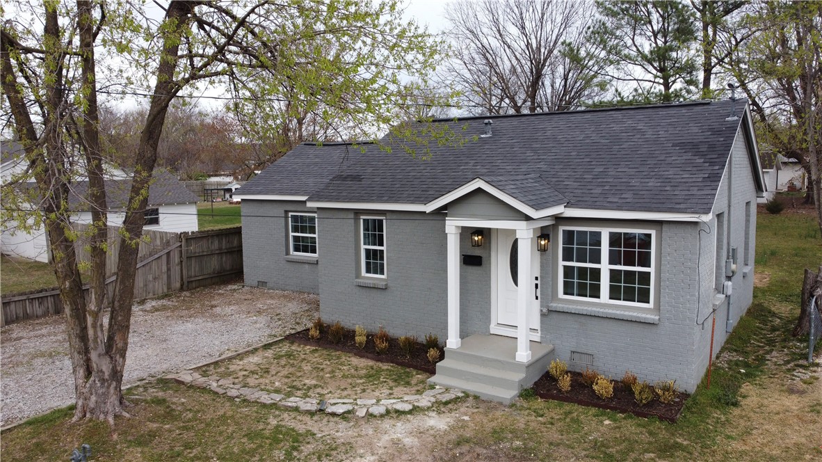 Must see charmer in excellent location! Easy access from any direction! All brick beauty near downtown Springdale has had a total makeover! Fresh paint, new floors, windows, ceiling fans! Two fully redone bathrooms with huge showers in both! New heat/air and water heater will keep it all running! All new electrical throughout! Wonderful very large fenced backyard for all of your family needs, Minutes from downtown Emma, 71 business and Highway 265, has you going any direction at your fingertips! Must see family friendly neighborhhod!