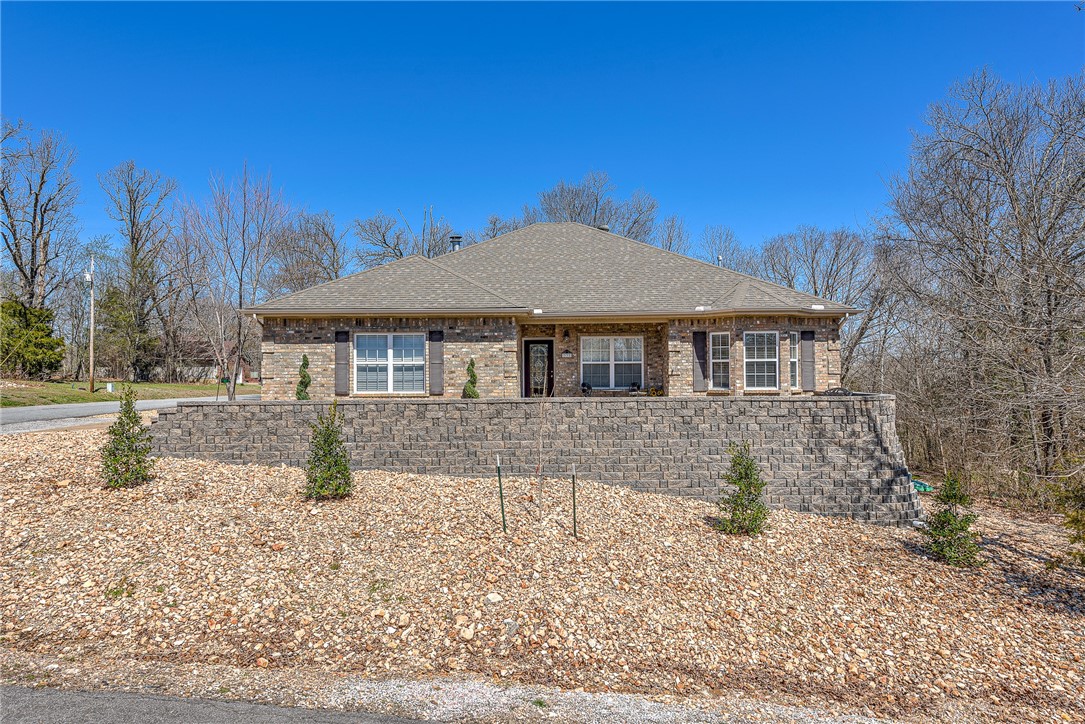 This Loch Lomond area home is bright, clean, and move-in ready! Tons of substantial updates, such as new composite deck and deck foundation, dual heat pump HVAC system and new ducts to save on utility costs. Also, a new retention wall, porch, sidewalk, and landscaping have been constructed in front. The main level of the home contains 3 bedrooms and 2 full bathrooms, plus a great kitchen featuring double ovens and an electric range. Downstairs you will find a walk-out, finished basement that opens up to the park-like lot. This open yard is surrounded by trees, giving it a private feel, even in a subdivision. You will definitely appreciate this home's flat driveway, a rare find near the lake! Home is about 5 miles (around a 10 minute drive) from the mountain biking trails, Tunnel Vision, Lago Vista West, Bamboozled, and more.