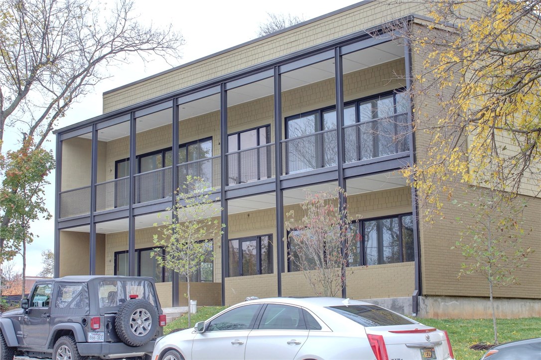 Mark Zweig, Inc. complete recreation of an original Seagraves designed building a 1/2 block from Dickson St. One level with a wide open floorplan and desirable finish-out. Enjoy high ceilings, wide hallways, wide staircases, wood windows and large spacious rooms. Designed for natural light with an eight foot high wall of wood sliding doors provide access to the front porch. Comes with a garage, off-street parking and City parking passes.