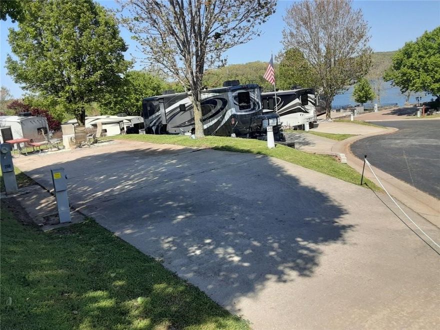 Welcome to Table Rock Lake and the 95 acres we call Outdoor Resort at the Ozarks. Year Round fun will be yours while calling this level concrete RV pad home, your going to love that its completely landscaped with private entry. Roads are all paved surfaces and all sites offer full utilities with 50 amp hook ups. This Exclusive Resort offers 2 pools, tennis courts, pickle ball, fitness center, walking trails, lake access, a club house and a lake front frisbee golf. Best suited for 35 ft accommodation - Call me today for your tour and together we can Check out lot #258