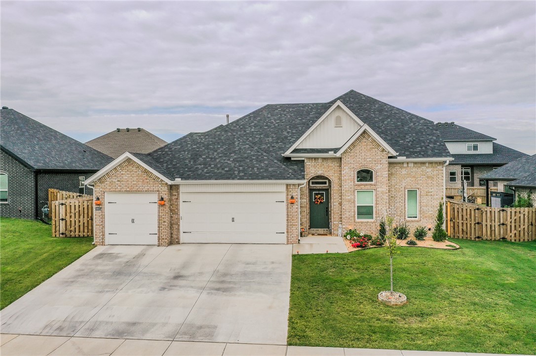 Welcome to this beautifully designed 4-bedroom, 2-full + 1-half bath home ideally located in the heart of Pea Ridge. The open-concept layout seamlessly connects the living, dining, and gourmet kitchen areas — perfect for everyday living and entertaining. The main-level primary suite offers convenience, privacy, and ease of living with no stairs to climb.
The upstairs includes three additional bedrooms, while the lower half bath is thoughtfully placed for guests. Enjoy extra storage with attic access, and the 10×16 shed adds flexibility for your outdoor tools or hobbies. A generous poured concrete slab in the back yard provides the ideal foundation for outdoor gatherings, barbecues, or play space.
Don’t forget the three-car garage, which offers ample parking and storage. With all these features in a central Pea Ridge location, you’re close to shopping, dining, schools, and community amenities.