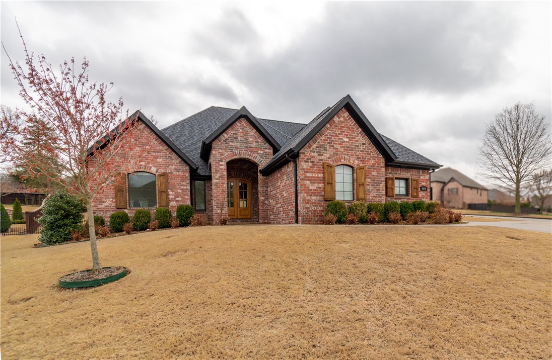 Stunning custom home in the sought after Heritage Hills gated community! Located in the heart of NWA, you are only minutes from I-49, shopping, dining, and all that Northwest Arkansas has to offer. Home features a beautiful open/split layout, 4 bedrooms, an office/study, 3.5 baths, spacious bonus room, 3 car garage, 48 inch Thor 6 burner gas range, large kitchen with island and peninsula, hardwood floors, 2 large exposed wood trusses in living room, massive picture windows overlooking back porch and pool, quartz counter tops, heated in ground gunnite pool, covered back porch, and so much more!