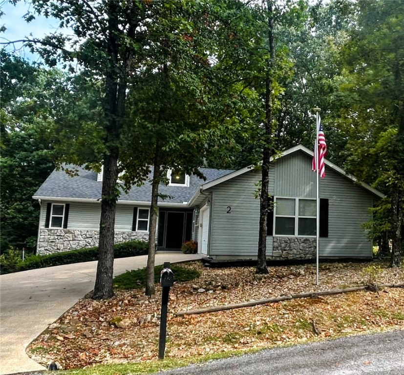 Must see 2 bdrm 2 bath 1569 sq ft home on a double lot (.81 acre) with a view in the tree tops. Multiple windows and doors bring in sunlight. Gas log fireplace provides heat and ambiance. The furnace switches to a 500# propane tank when outside temp hits 32. The chefās kitchen has double ovens and a gas stovetop. Double pantries with pull out drawers and glass front upper cabinets add to the beauty and function. The large primary suite glass doors showcase the covered veranda and beautiful views. A walk-in closet and primary bath complete the suite with two sinks, garden tub and separate shower. Relax from the large deck surrounding the length of the back of the house. New roof, gutters and furnace in 2025. Excellent storage under the deck and a walk-in basement for secured storage. Close to Hwy 71 and bike trails. This house is perfect as a primary home, weekend getaway or investment property. As a Bella Vista property owner, youāll enjoy access to many amenities. See bellavistapoa.com.