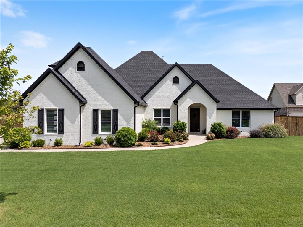 Stunning luxury home in sought-after Tontitown neighborhood! This beautifully designed 4 BR, 4.5 BA custom home offering 4100 sq ft of elegant living space on a large 1.15 acre lot in one of Tontitown's most prestigious neighborhoods. Built in 2021 and move-in ready, this home showcases designer finishes throughout, including built-ins, upgraded appliances, and thoughtful architectural touches. The spacious main level features 3 BR with ensuite baths, including a luxurious primary suite with a spa-like bath and an oversized walk-in closet. A versatile office or formal dining space sits off the entry - perfect for a 5th bedroom or flex space. Upstairs, enjoy a large media room with wet bar, plus an additional flex space at the landing-ideal for a playroom, home gym or creative workspace. With a flat backyard ready for a pool and pool house, this property offers exceptional indoor and outdoor living potential. Don't miss your chance to own this one-of-a-kind home in a prime location.