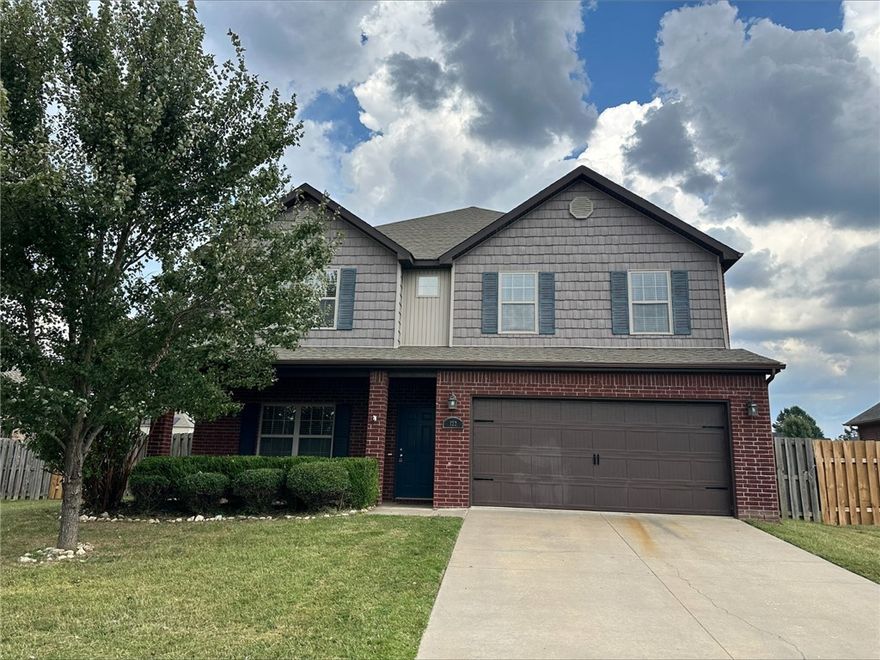 PERFECT home with lots of space and storage! Has all the added features from extended covered patio with HUGE fenced lot, gutters, granite countertops throughout, gas stovetop, & wood floors. This is spacious with two living spaces AND a bonus room upstairs. New carpet, fresh paint and new laminate flooring upstairs. Within walking distance to Tucker Elementary. Nice gated community and centrally located to all NWA has to offer.
