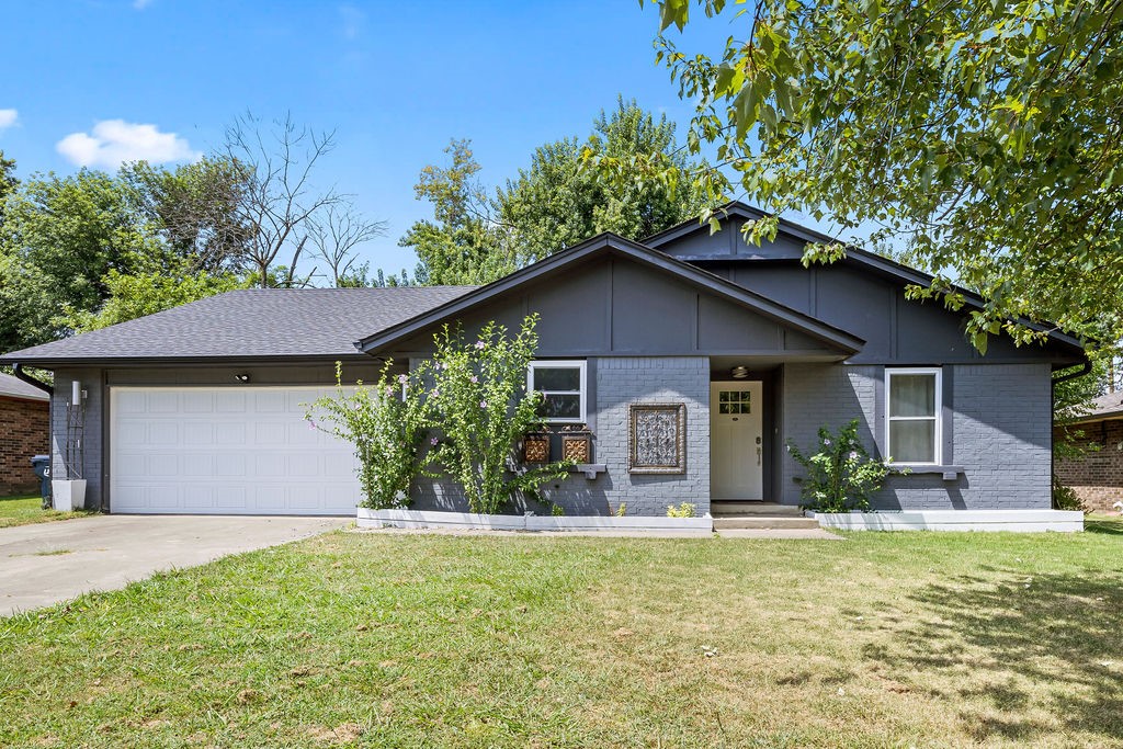 Welcome to the perfect blend of contemporary design and timeless character in this beautifully remodeled, 1668 sq ft, 3 bed/2 bath home. Situated on a .25 acre lot with mature trees, and located just 5 mins from the Pinnacle Hills Promenade, this home offers both privacy and convenience. Step inside to find an open-concept layout with a generous living room, gas log fireplace, vaulted ceilings, and luxury vinyl plank flooring. Featuring a stylish kitchen with both separate dining space and eat-in bar, an oversized primary suite, split floor plan, fully renovated bathrooms, and modern finishes throughout. Enjoy outdoor living under your covered porch, entertain around the firepit, and garden in raised beds. Washer/dryer room has dual entrance which adds extra convenience. New roof 2021. Updated windows. 10 min or less drive to I-49, Walmart AMP, Topgolf, Rogers Aquatic Center, and Hospitals. This home is perfect for anyone looking to enjoy the vibrant lifestyle of NWA while living in an established neighborhood.