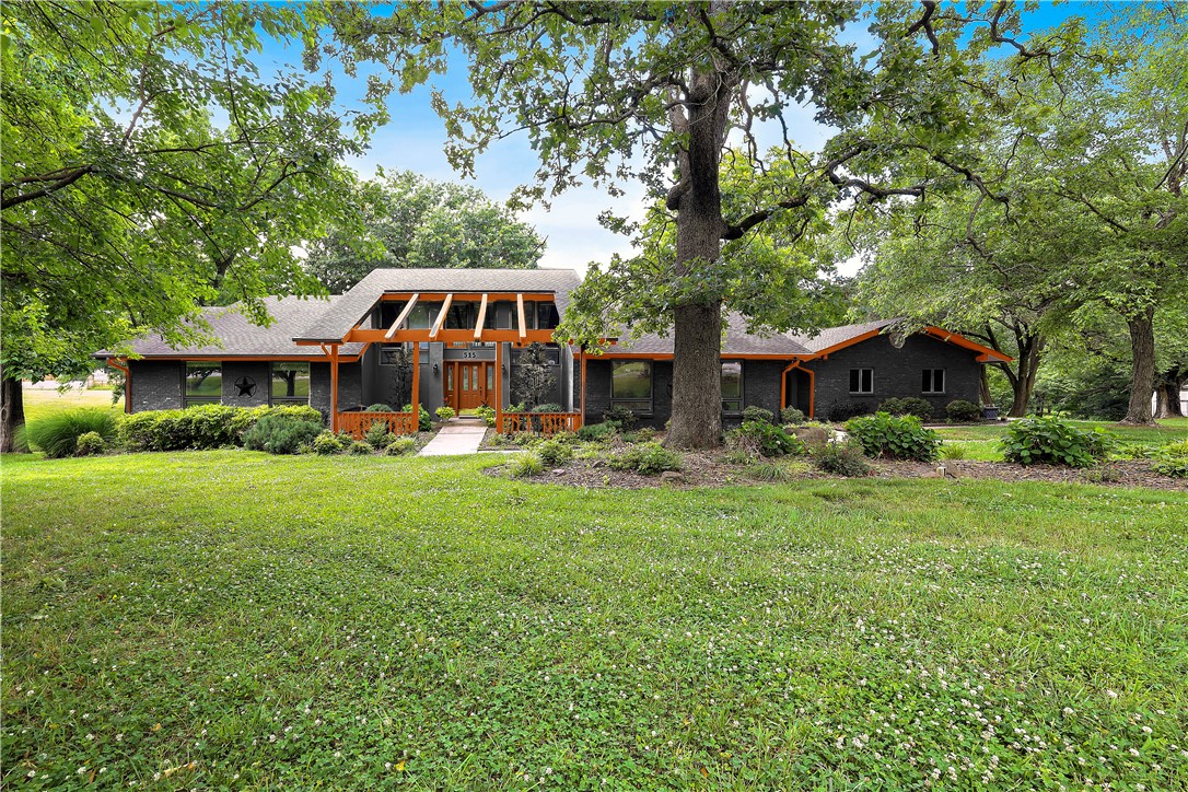 This stunning property is located in the heart of Downtown Bentonville, offering a park-like atmosphere
and spanning across an impressive 3.98 acres. The prime location provides an exceptional opportunity to
walk and bike to downtown shops, restaurants, as well as renowned attractions such as Crystal Bridges,
The Momentary, the Razorback Greenway, and more. The lush landscaped front and back yard showcases
the beauty of the surroundings, making it one of the most picturesque properties in the area. The
panoramic views afforded by the floor to ceiling windows are truly breathtaking. For those who enjoy
entertaining, this house offers a formal dining room with skylights, a billiard room and a media room,
complete with comfortable theater seating. Beyond the main residence, this legacy estate also includes a
detached workshop that offers tremendous potential.