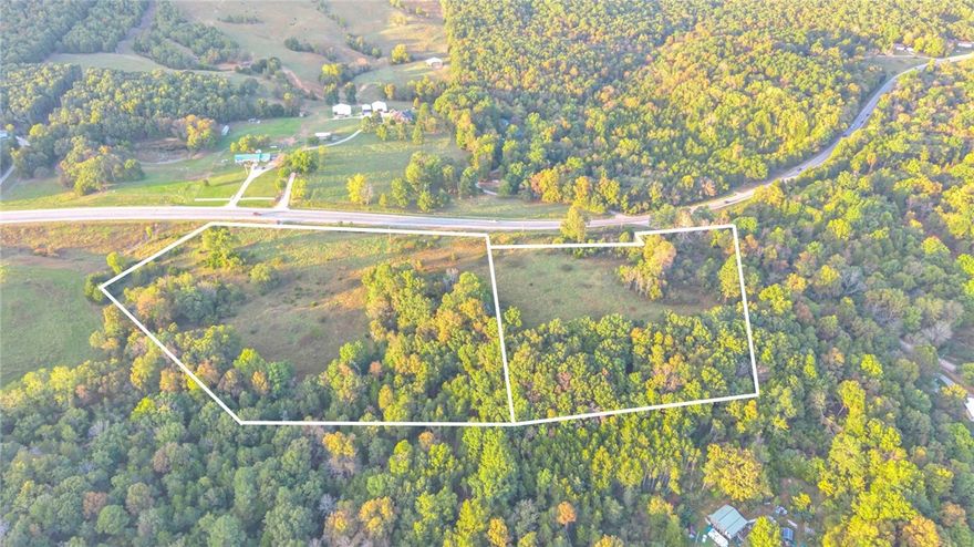 Discover a fantastic investment opportunity with this prime piece of land featuring major highway 412 frontage. With just over 13 acres, this versatile property offers endless possibilities. Whether you're looking to build a commercial space or your dream home, this one is for you. Enjoy the convenience of electric, water and cable already at the street. This listing is for 2 separate parcels; acreage shown reflects both parcels.
