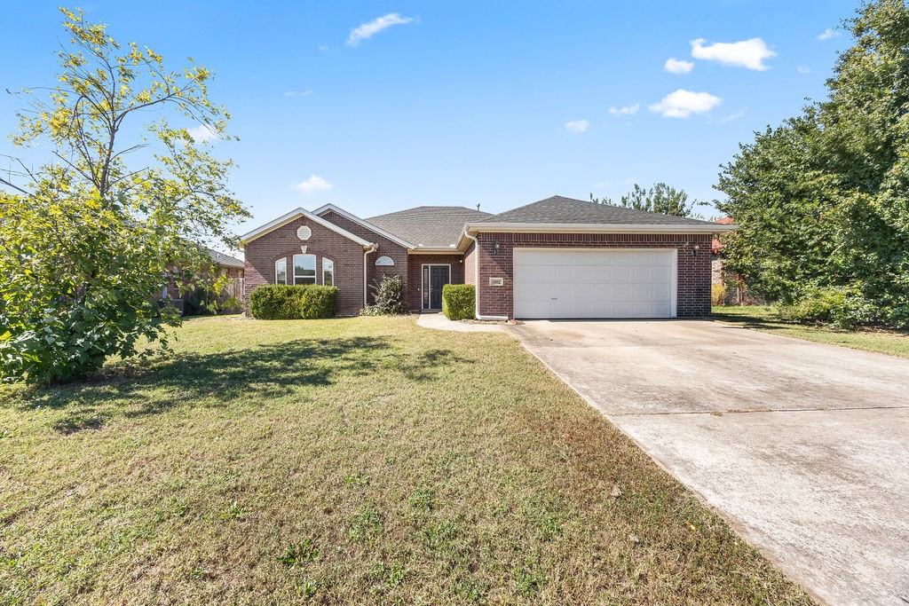 Location, location!! This charming All-Brick 3 Bedroom, 2 Bath Home is located in the highly sought-after Windwood Subdivision in Bentonville! This home is in the heart of it all, just minutes from the Walmart Home Office and within walking/biking distance to Creekside Park! This spacious home features a very large living room with a cozy gas log fireplace, perfect for relaxing or entertaining. The eat-in kitchen offers ample counter space with beautiful granite countertops, a pantry, and room for a large dining table. The generous primary suite includes trayed ceilings, walk-in closets, and a private bath with a separate shower and soaking tub. The fenced back yard is spacious and features a covered patio. Recent updates include: a new AC (2023), a new roof (4/2025), all new windows (2019), brand new LVP flooring in main living area (10/2025) and updated garage seals (2021).