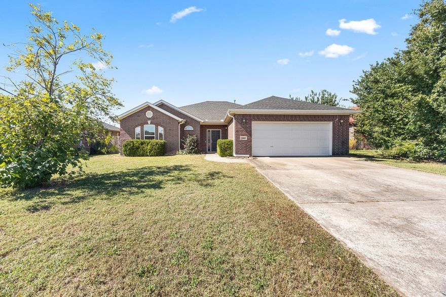 Location, location!! This charming All-Brick 3 Bedroom, 2 Bath Home is located in the highly sought-after Windwood Subdivision in Bentonville! This home is in the heart of it all, just minutes from the Walmart Home Office and within walking/biking distance to Creekside Park! This spacious home features a very large living room with a cozy gas log fireplace, perfect for relaxing or entertaining. The eat-in kitchen offers ample counter space with beautiful granite countertops, a pantry, and room for a large dining table. The generous primary suite includes trayed ceilings, walk-in closets, and a private bath with a separate shower and soaking tub. The fenced back yard is spacious and features a covered patio. Recent updates include: a new AC (2023), a new roof (4/2025), all new windows (2019), brand new LVP flooring in main living area (10/2025) and updated garage seals (2021).