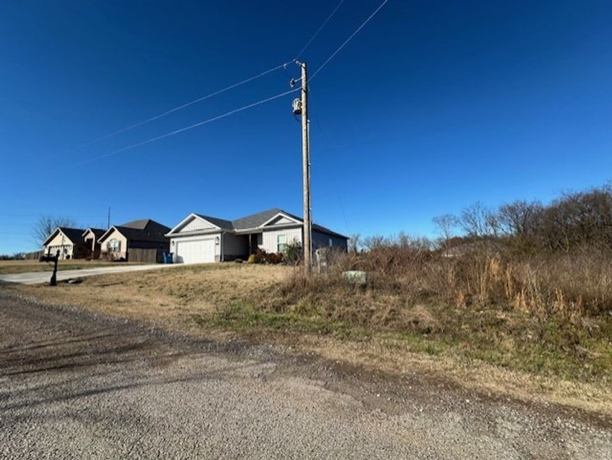 Cleared and simi-level corner lot! Perfect for a side-load Garage floorplan! Conveniant to I-49. Seller also is selling  lot MLS #1332634 not too far from this lot! check it out also!!